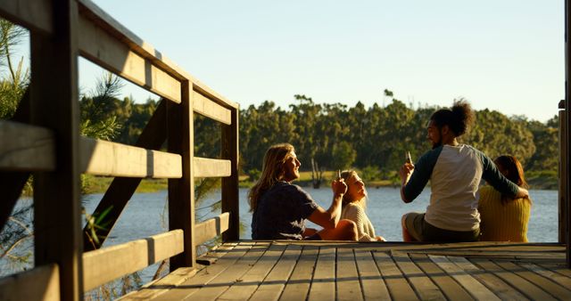 Group of Friends Enjoying Sunset by Lake - Download Free Stock Images Pikwizard.com