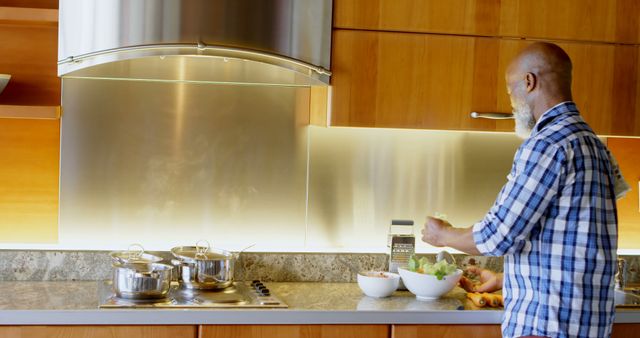 Man Preparing Healthy Meal in Modern Kitchen - Download Free Stock Images Pikwizard.com