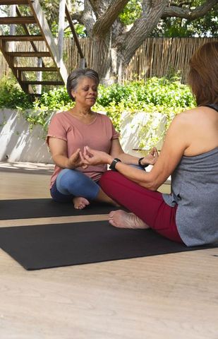 Serene Backyard Yoga Session with Diverse Female Friends