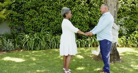 senior couple embracing love garden wedding ceremony - Download Free Stock Images Pikwizard.com