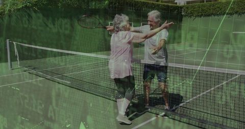 Joyful Senior Couple Celebrating on Tennis Court Outdoors