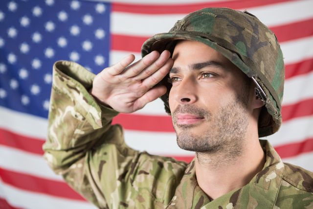 Confident Soldier Saluting Against American Flag - Download Free Stock Photos Pikwizard.com