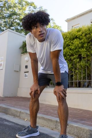 Athletic Man Catching Breath Outdoors Living Active Lifestyle