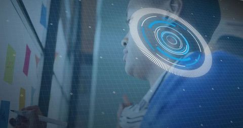 Businessman studying sticky notes with futuristic hud overlay during team brainstorming