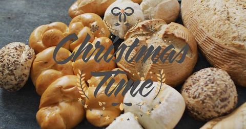 Christmas time banner showcasing artisan bread assortment on dark slate