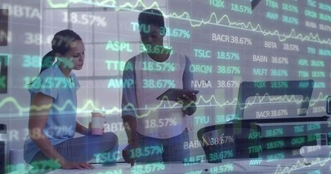 Diverse Coworkers Analyzing Financial Market Data in Modern Office