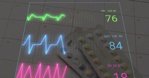 Blister packs on monthly planner with holographic vital signs display for health tech