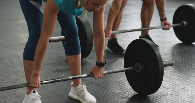 Fitness Enthusiasts Lifting Barbells for Strength Training at Gym - Download Free Stock Images Pikwizard.com