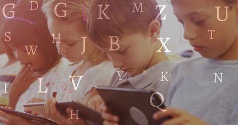 Engaged children using tablets for creative educational activities