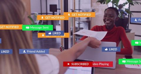 Smiling colleague receiving printed document amid digital notification overlays in office