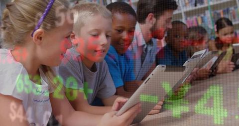 Students with Teacher Using Tablets in Library