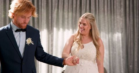 Joyful wedding dance of newlywed couple celebrating love