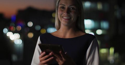 Businesswoman Using Smartphone at Night with Confidence