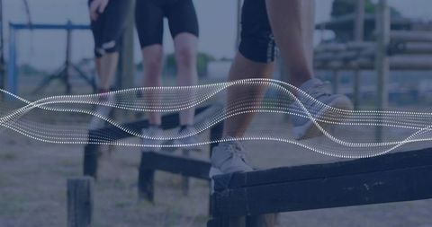 Women Conquering Outdoor Obstacle Course with Steady Determination