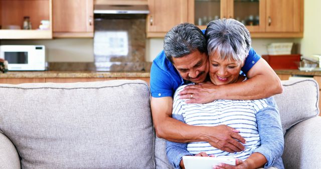 Senior Couple Hugging on Couch Sharing Quality Time - Download Free Stock Images Pikwizard.com