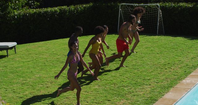 Group of Friends Running Towards Pool on Sunny Day - Download Free Stock Images Pikwizard.com