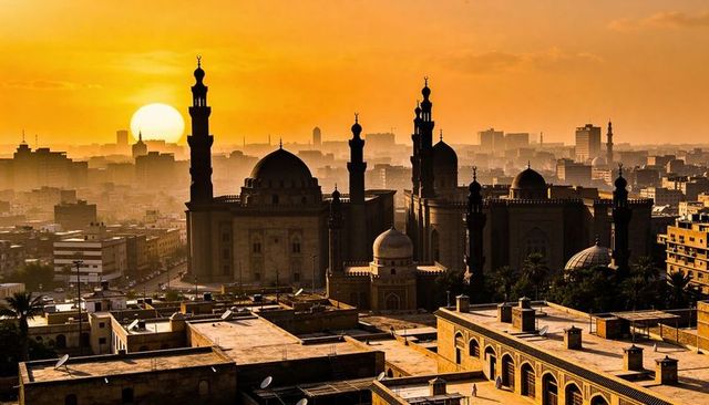 Glowing mosque skyline silhouetting rooftop terraces and minarets at golden hour