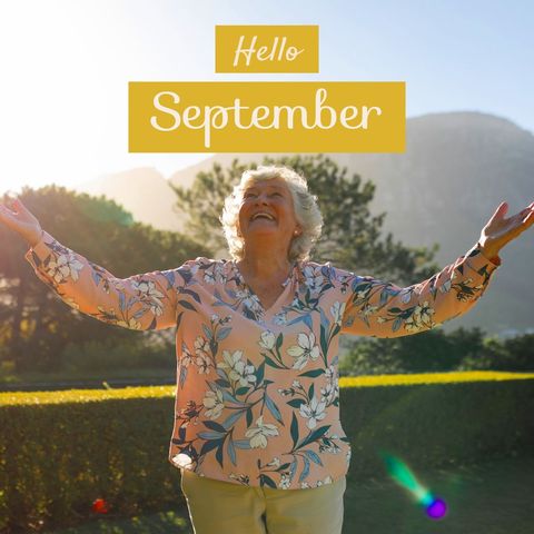 Joyful senior welcoming september in sunny garden