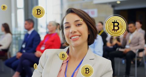 Business Professional in Tech Conference with Bitcoin Symbols