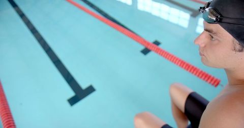Female Swimmer Preparing for Race in Competition Pool