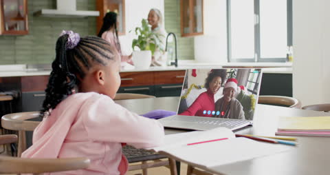 Happy Family Enjoying Christmas Video Call on Laptop