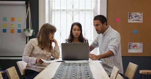 Creative Team Collaborating on Laptop in Office Meeting - Download Free Stock Images Pikwizard.com