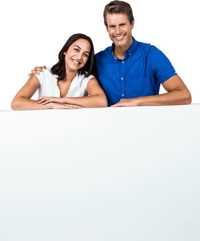 Smiling couple standing behind transparent banner