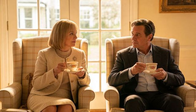 Middle-aged couple sharing afternoon tea in elegant lounge with plaid armchairs