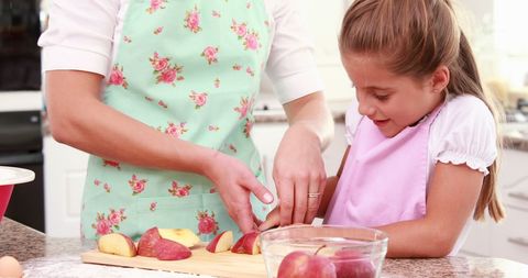 Mother and Daughter Bonding while Preparing Apples in Kitchen - Download Free Stock Images Pikwizard.com