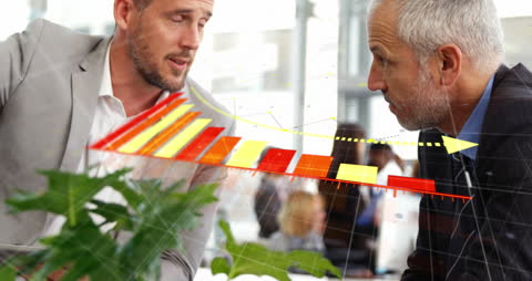 Business Partners Analyzing Financial Data with Digital Graphics