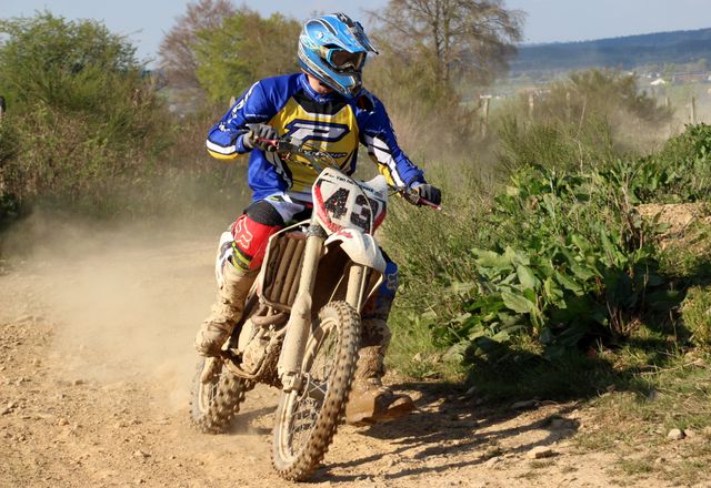 Motocross Rider Racing on Dirt Track in Outdoor Terrain - Download Free Stock Photos Pikwizard.com