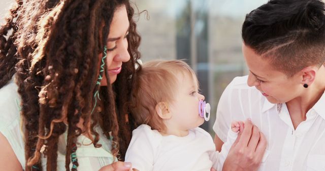 Loving Lesbian Mothers Enjoying Quality Time with Baby - Download Free Stock Images Pikwizard.com