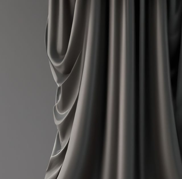 This close-up image of black silk drapes showcases the intricate folds and smooth texture of the fabric, creating a sense of elegance and luxury. It is ideal for use in textile design projects, fashion, interior decor inspiration, backgrounds, and abstract art concepts.