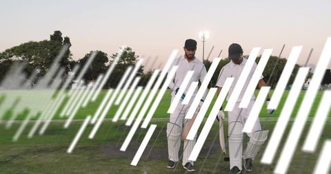 Cricket teammates walking off pitch at dusk carrying bats and pads with graphic streaks