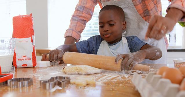 Boy Rolling Dough with Adult Supervising in Kitchen - Download Free Stock Images Pikwizard.com