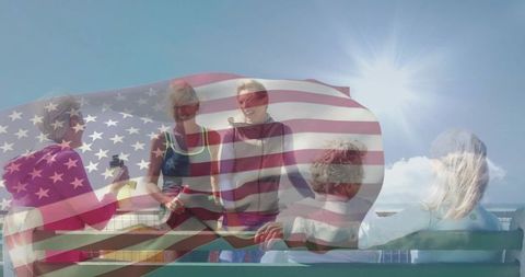 Women enjoying conversation on sunny seaside deck