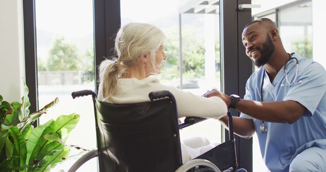 Image of happy african american male doctor taking care of caucasian senior woman - Download Free Stock Photos Pikwizard.com