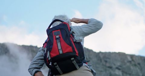 Senior Man Hiking Adventure on Mountain Trail Outdoors