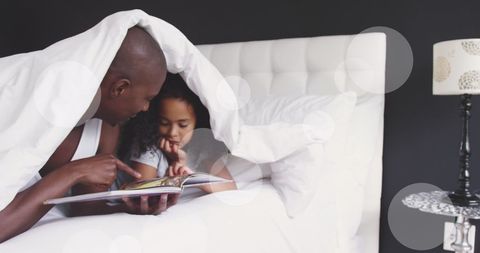 Father and Daughter Reading Story Together in Cozy Bed - Download Free Stock Images Pikwizard.com