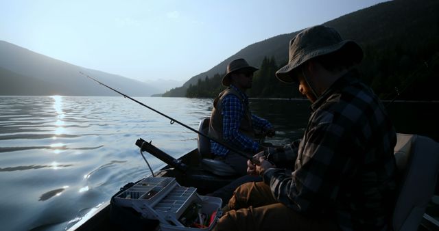 Men Fishing on Tranquil Lake at Sunrise - Download Free Stock Images Pikwizard.com