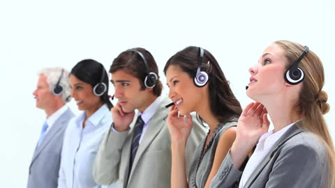 Customer Service Team Using Headsets for Assistance