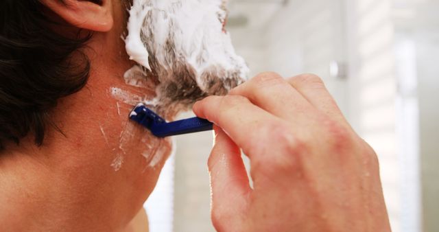 Man Shaving with Razor in Bathroom - Download Free Stock Images Pikwizard.com