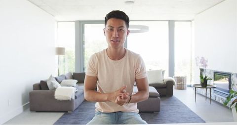 Young Man Makes Video Call in Modern Contemporary Living Room - Download Free Stock Images Pikwizard.com