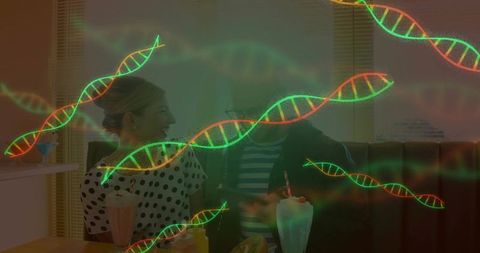 Couple sharing milkshakes in retro diner with dna strands overlay symbolizing genetics