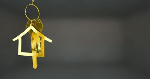 Golden House-Shaped Keychain Symbolizing Real Estate Investment