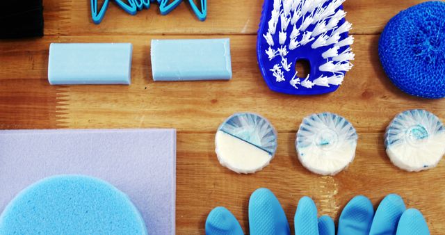 Blue Cleaning Supplies Arranged on Wooden Surface - Download Free Stock Images Pikwizard.com