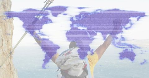 Adventure hiker celebrating on coastal cliff with glitch world map overlay