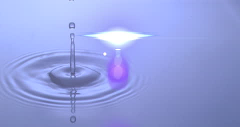 Serene Water Droplet with Light Reflecting in Ripples