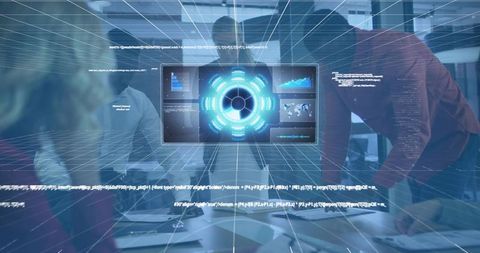 Team analyzing holographic dashboard over conference table in futuristic office