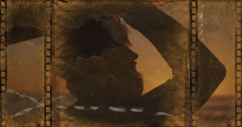 Silhouette of Man Admiring Sunset with Vintage Film Overlay